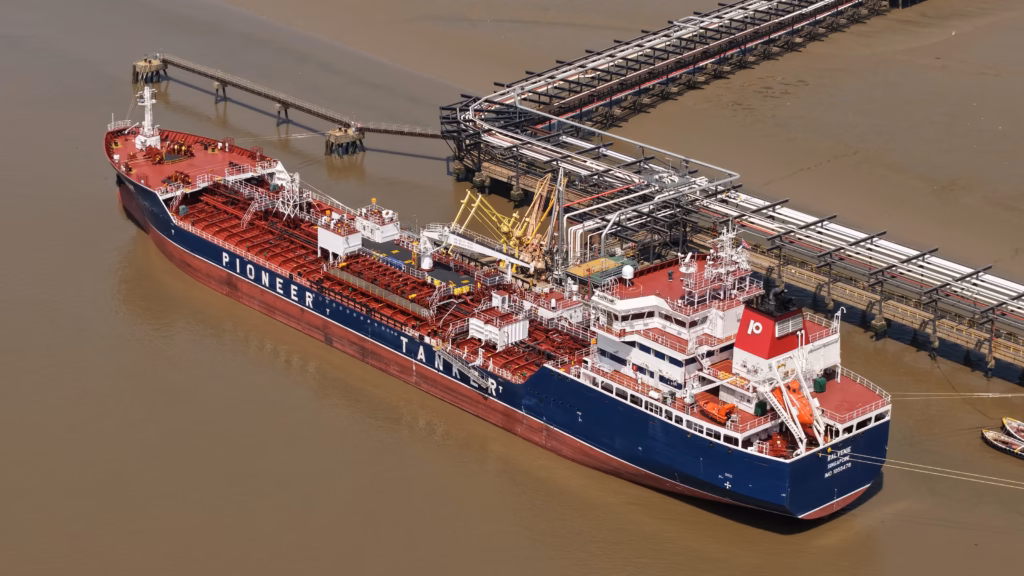 The product tanker Balvenie alongside an oil terminal jetty on the lower Thames, loading arms connected and the cargo manifold visible