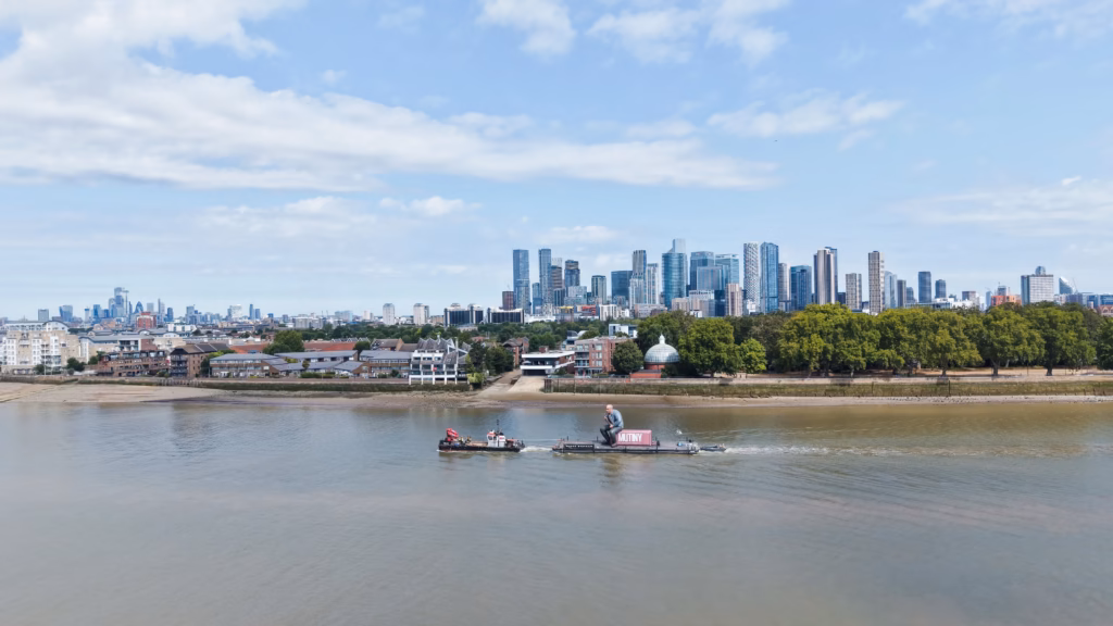 Mutiny: Jason Statham Brand Activation on the Thames 4 Wide aerial photograph of the Mutiny activation tow in Greenwich Reach, with the Isle of Dogs and the City of London skyline behind