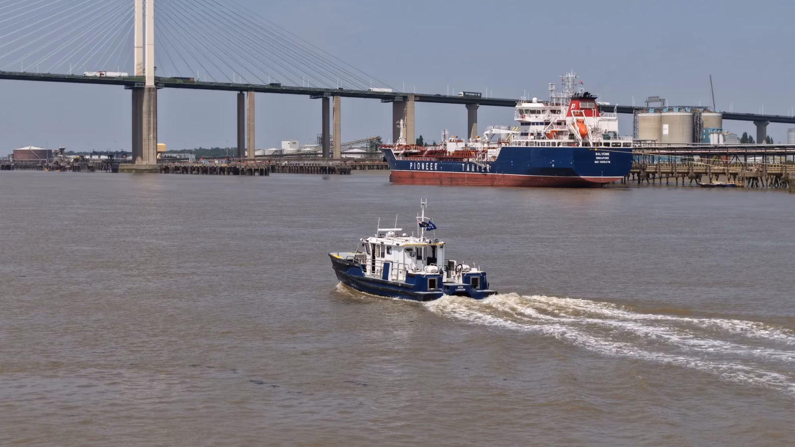 Port of London Authority harbour service launch Kew beneath the Queen Elizabeth II Bridge at the Dartford Crossing, aerial drone photograph