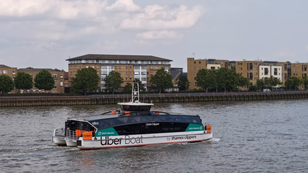 Uber Boat by Thames Clippers Orbit Clipper river service on the River Thames in London, aerial drone photograph