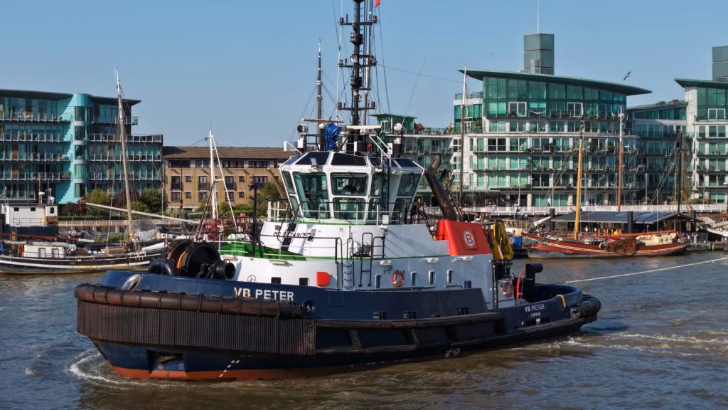 Boluda tugs working on the River Thames in London, photographed from the air