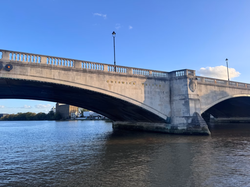 The main arch of Chiswick Bridge from the river at Mortlake