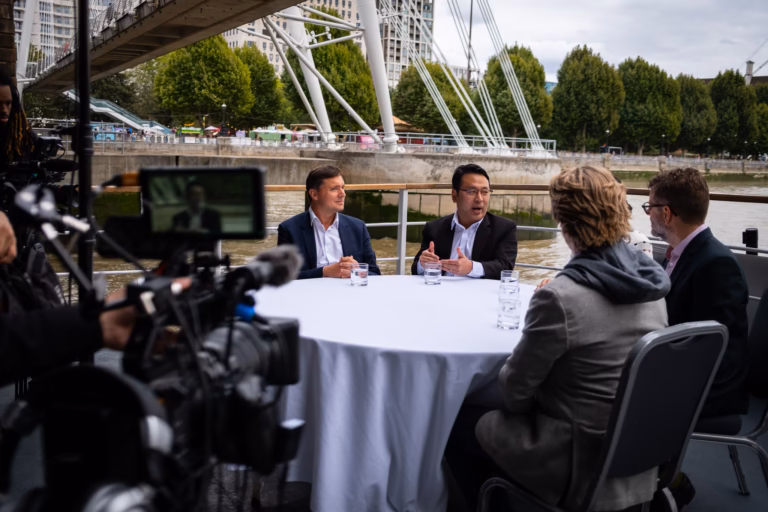 Camera on the roundtable as the boat passes the Golden Jubilee Bridges on the Thames