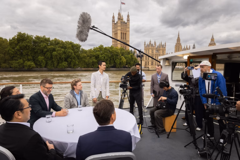 Multi-camera roundtable shoot on the Thames by Westminster, with a boom, cameras and crew on deck